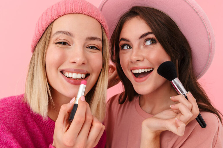 Two ladies trying cosmetics